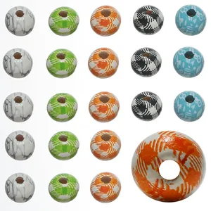 Macro detail of mixed 8mm wooden beads with plaid and floral patterns for DIY jewelry