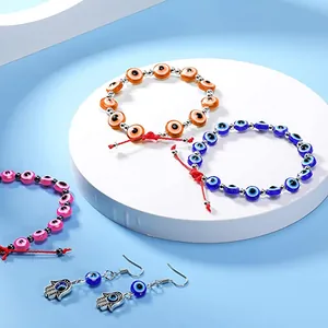 DIY evil eye jewelry set with resin beads hamsa hand charms and colorful bracelets