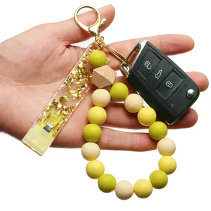 Porte-clés extracteur de carte avec perles silicone jaunes et clip en acrylique