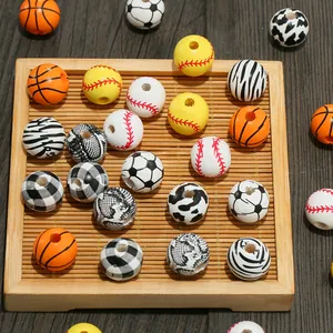 Assorted sports and animal print wooden beads for DIY jewelry making in bamboo tray