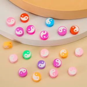 Macro shot of colorful flat round Tai Chi Yin Yang resin spacer beads for DIY jewelry making