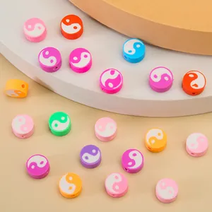 Close-up of colorful Tai Chi pattern polymer clay beads for DIY jewelry making