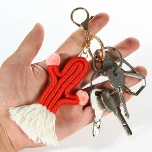 Handmade woven cactus keychain with red cotton rope tassels and golden lobster clasp