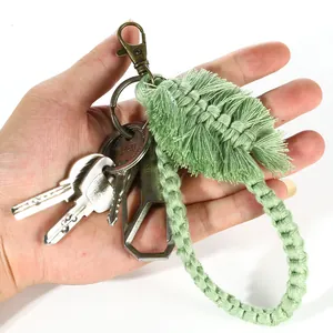 Handmade woven cotton mint green leaf keychain with bronze lobster clasp on a keyring