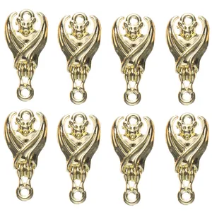 Detailed close-up of eight gold-plated alloy bat charms for DIY jewelry making