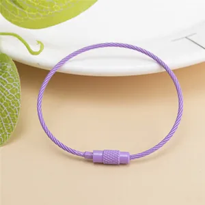 Detail view of purple coated steel wire keychain ring with secure screw lock mechanism