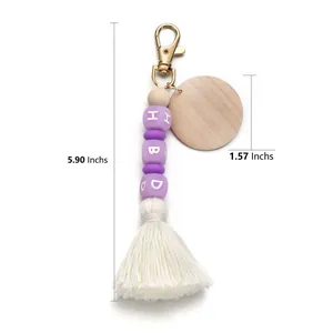 Purple silicone letter beads keychain with white tassel and round wooden disc pendant