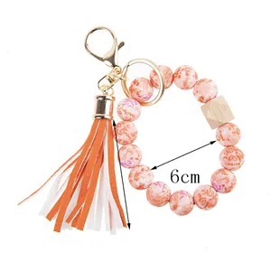 Detail of beaded keychain bracelet showing a 6cm inner diameter with pink love heart beads