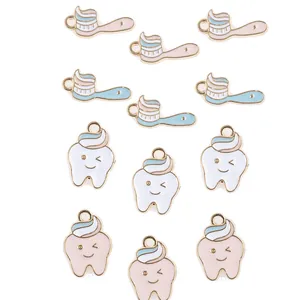 Cartoon tooth and toothbrush enamel pins with pink and blue colors for DIY accessories