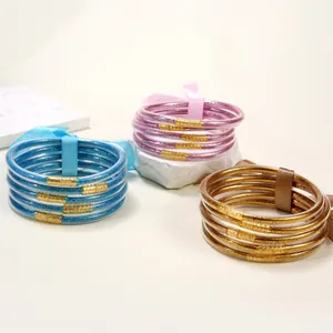 Set de 5 pulseras de silicona con purpurina en oro, azul y púrpura con cierre metálico