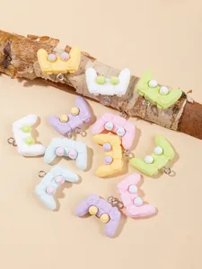 Miniature resin game controller charms in macaron colors with metal loop for DIY crafts