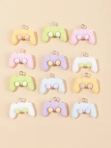 Macro shot of 12 colorful resin game controller charms with metal hooks for DIY crafts