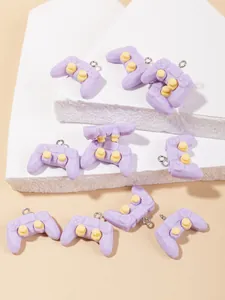 Detailed view of 10 purple resin game controller charms for DIY jewelry and crafts