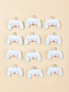 Detailed view of 12 blue resin retro game controller charms with silver eyelet hooks