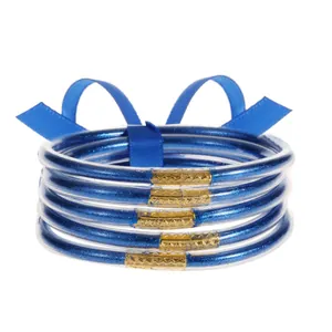 Set de 5 pulseras de silicona con purpurina azul y cierres metálicos dorados