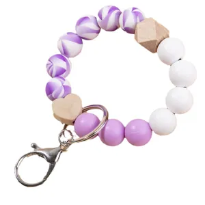 Llavero de pulsera con cuentas de silicona y madera, espirales moradas y colgante de corazón