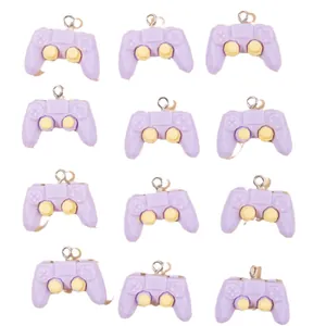 Set of 12 purple resin game controller pendants with yellow joysticks for DIY jewelry crafts
