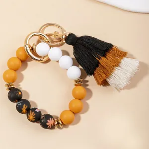 Bohemian silicone beaded keychain bracelet with colorful beads and triple-color tassel charm