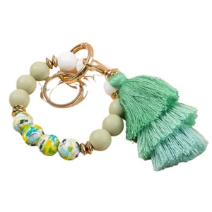 Bohemian silicone bead keychain bracelet with tropical print beads and green tassel charm