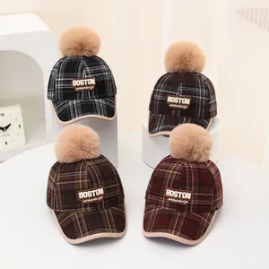 Winter kids plaid baseball caps with Boston patch and plush pom pom decorations