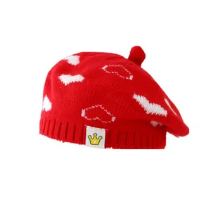 Red knit beret for kids with white heart patterns and crown logo for autumn winter