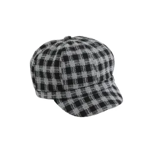 Retro grey plaid newsboy cap for kids made of warm wool blend fabric on white background
