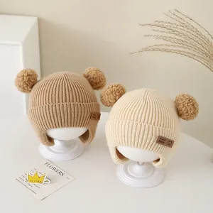Warm baby knit hats with bear ears and earflaps in khaki and off-white colors