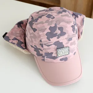 Detail of pink camouflage winter hat for kids with fleece lining and NYC label