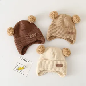 Winter baby knit hats with bear ears and handmade label in brown, khaki and beige colors