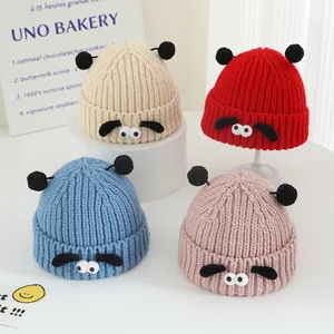 Lot de bonnets tricotés pour enfants avec yeux de dessin animé et pompons colorés