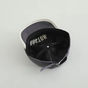 Detail of dark grey baby baseball cap with adjustable metal buckle and BOSTON embroidery