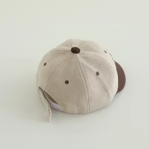 Detail view of corduroy texture and adjustable strap on the toddler baseball cap