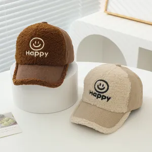 Sherpa and corduroy baseball caps with Happy smiley embroidery in caramel and beige colors