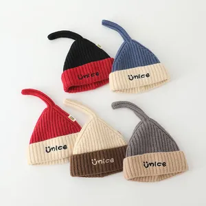 Colorful knit elf beanies for babies with unice embroidery and soft pom pom tails
