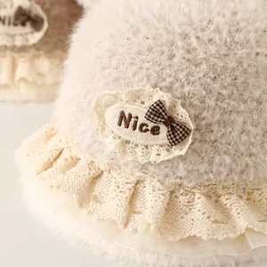 Winter plush baby bucket hat in cream white with lace trim and cute bow detail