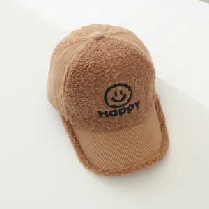 Close-up of the khaki corduroy fabric and soft sherpa trim with Happy embroidery