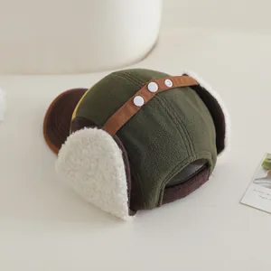 Winter bomber hat for children with warm fleece ear flaps and colorful patchwork design