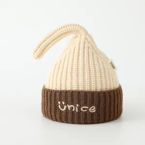 Close-up of thick knit winter hat for kids with bicolor design and NICE embroidery