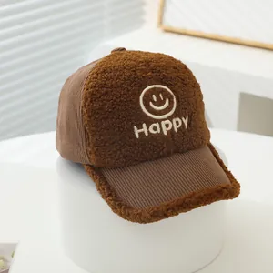 Brown corduroy and sherpa baseball cap featuring a white Happy smiley face embroidery