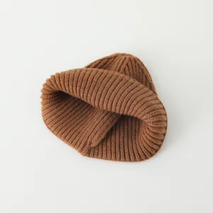 Winter warm knitted beanie in caramel brown with thick vertical ribbed texture