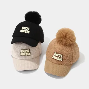 Winter fleece baseball hats for kids featuring plush pom poms and Music patch design