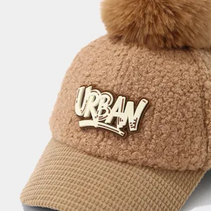 Brown fleece baseball cap for kids with fluffy pompom and Urban letter embroidery