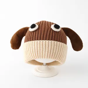 Detailed close-up of knit texture on baby winter dog hat with brown long ears