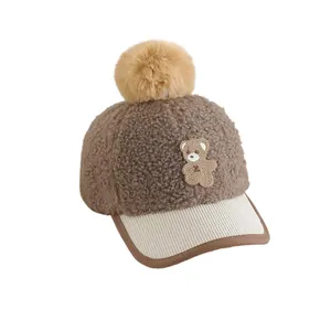 Winter kids baseball cap with fleece texture, teddy bear embroidery and faux fur pompom