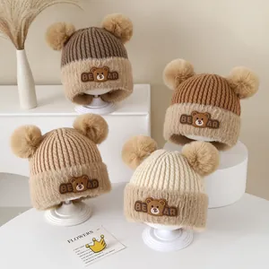 Winter baby knit earflap hats with pom-poms and cute bear patches in four earthy tones