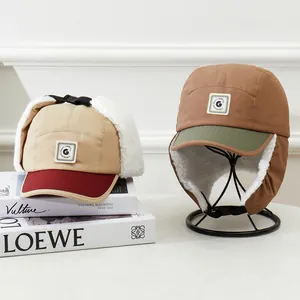 Winter aviator hats with warm fleece lining and ear flaps in khaki and beige colors