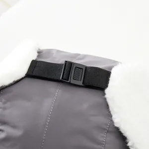 Detail of adjustable buckle and waterproof fabric on children's winter earflap hat
