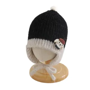 Baby knit earflap hat with cute dog patch and white pompom for autumn winter warmth