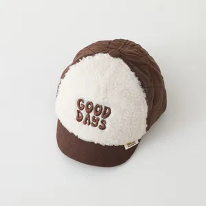 Detail of warm lamb wool and quilted texture on a brown baby baseball cap