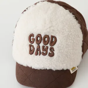 Close-up of sherpa fleece baseball cap with GOOD DAYS embroidery and quilted brim